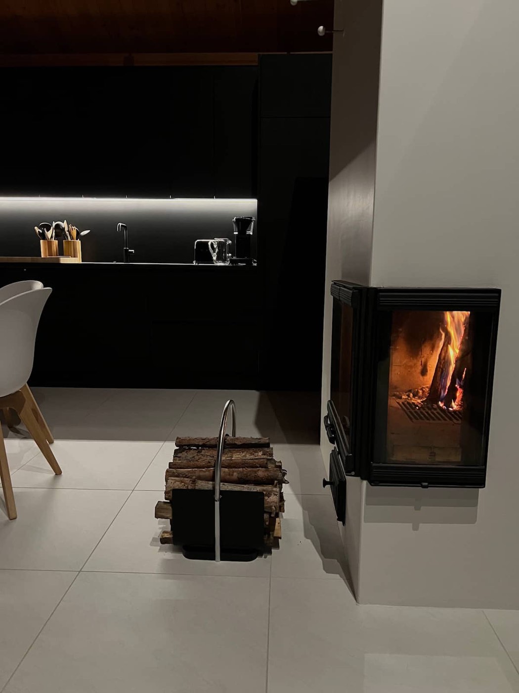 Modern black fireplace with a fire burning